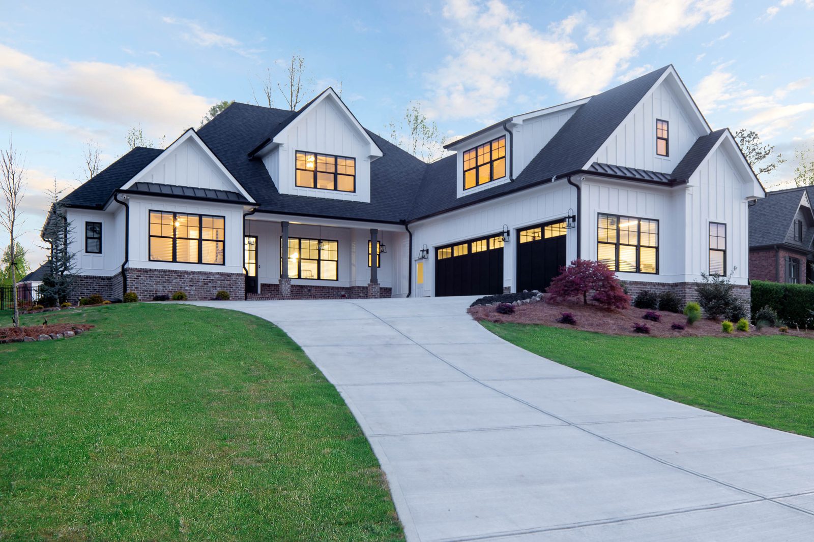 Front elevation seen from the curved driveway — Glausier, custom home built by Ironwood Construction Group
